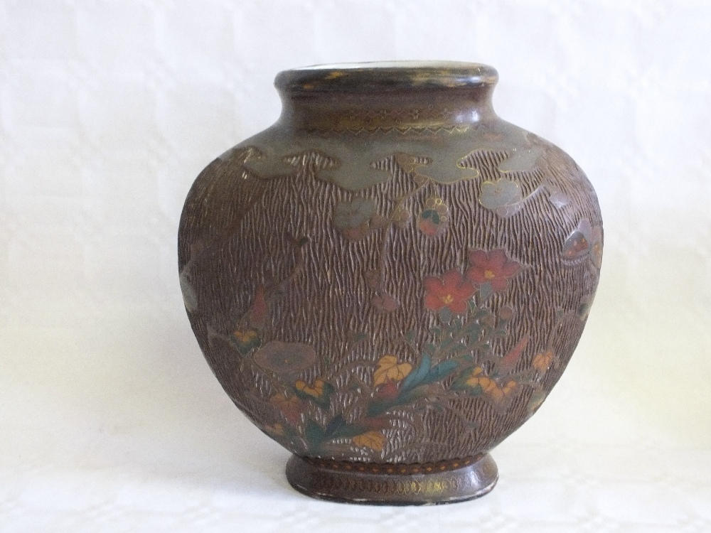 A Japanese porcelain and Cloisonne vase