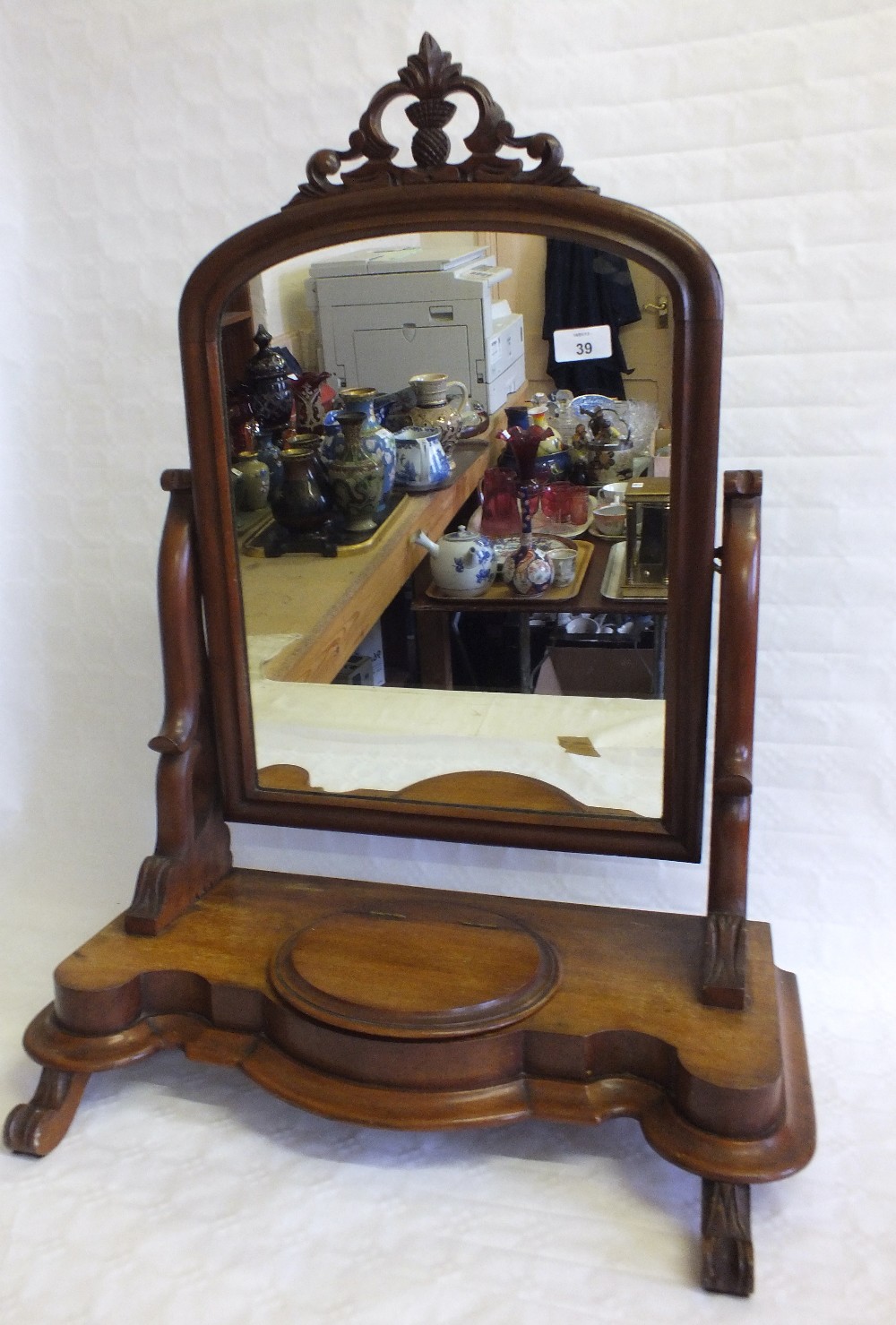 A Victorian Mahogany swing mirror with compartment