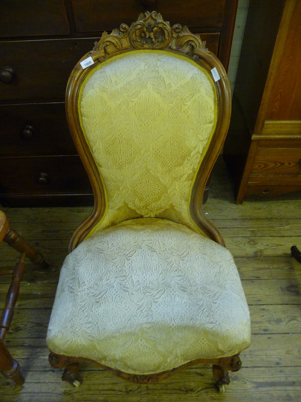 A Walnut spoon back nursing chair