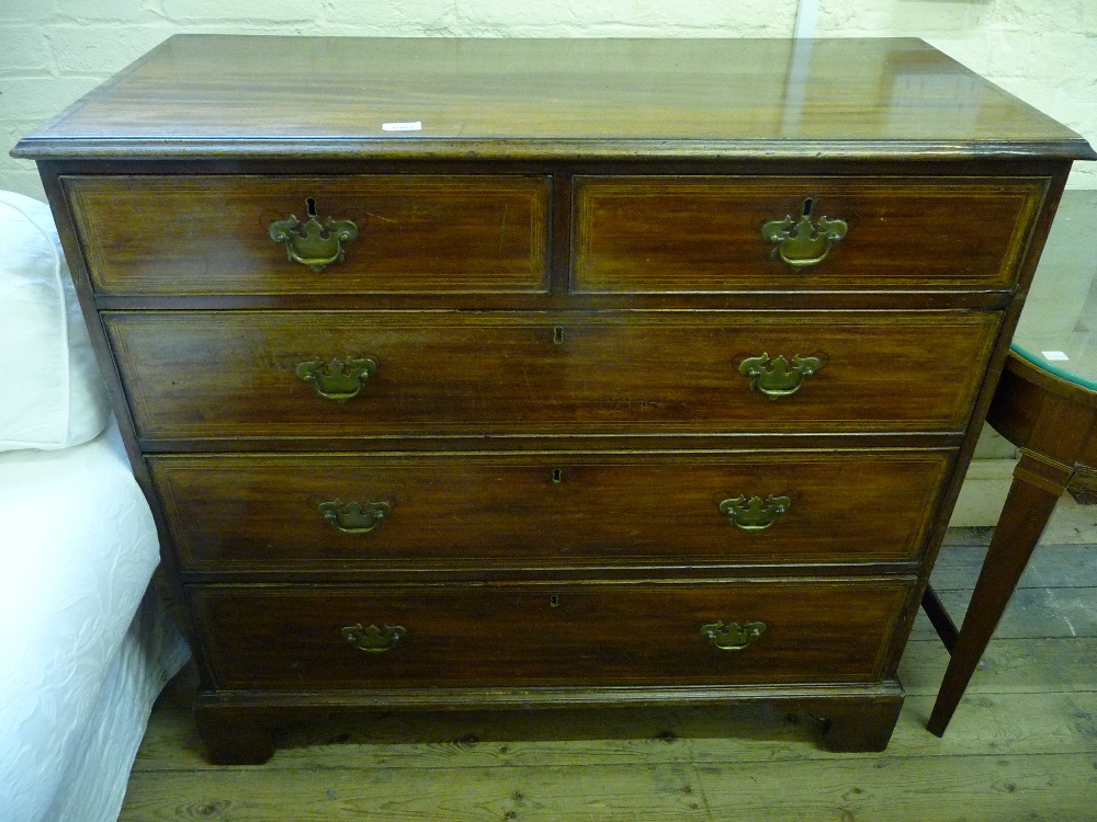 An inlaid Mahogany chest of three short and three long drawers