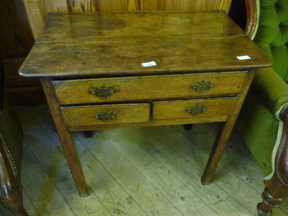 An 18th Century Oak side table of one long and two short drawers