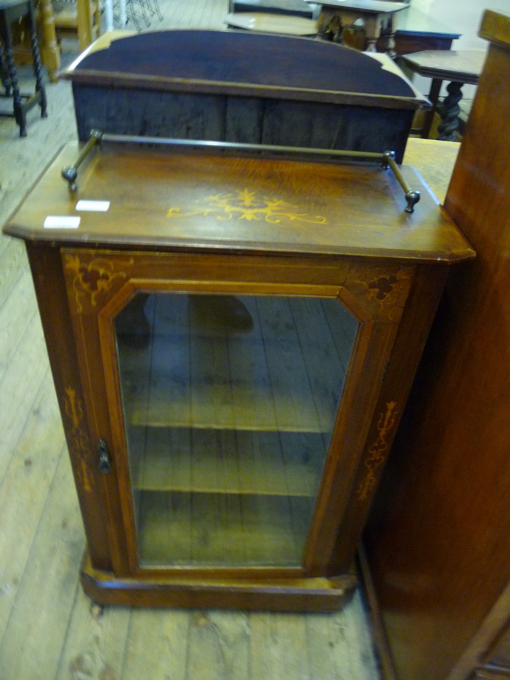 An Victorian inlaid glazed and galleried music cabinet