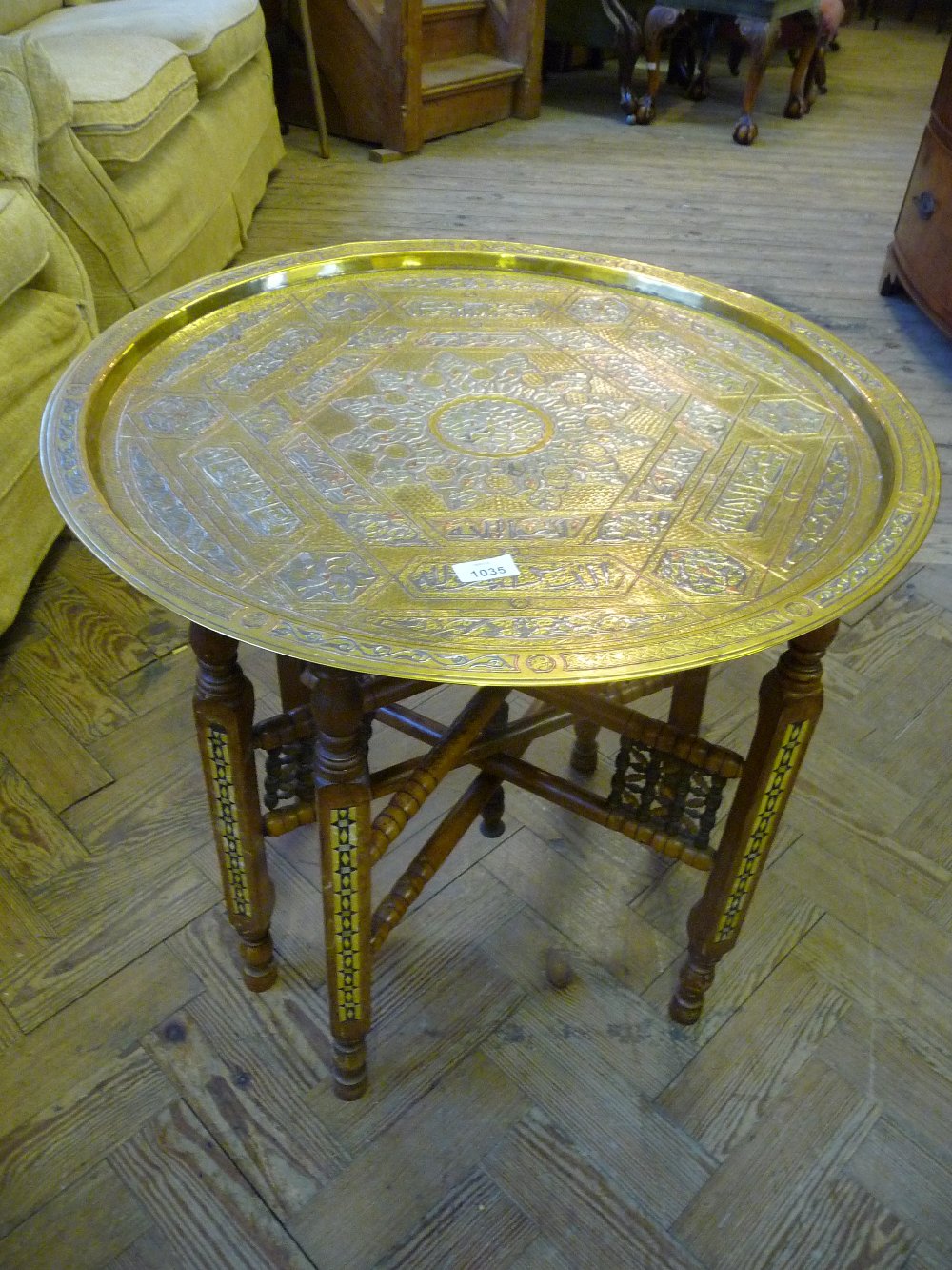 An Eastern folding Brass topped occasional table