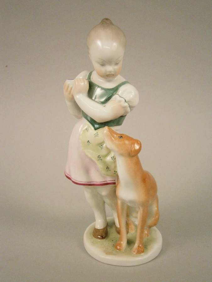 A Herend porcelain figure of a young girl and a hound, older printed mark to base and impressed mark