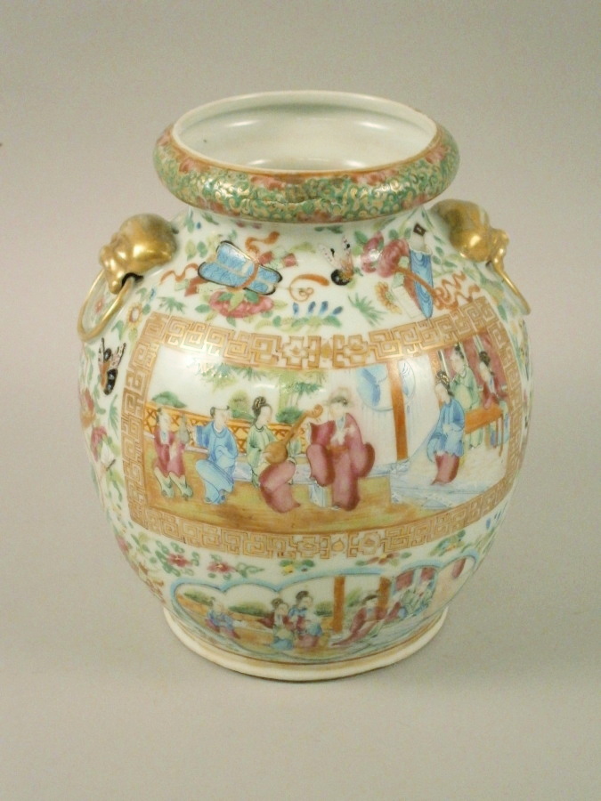 A late 19thC Chinese Canton porcelain two handled vase, decorated with figures within panels, with