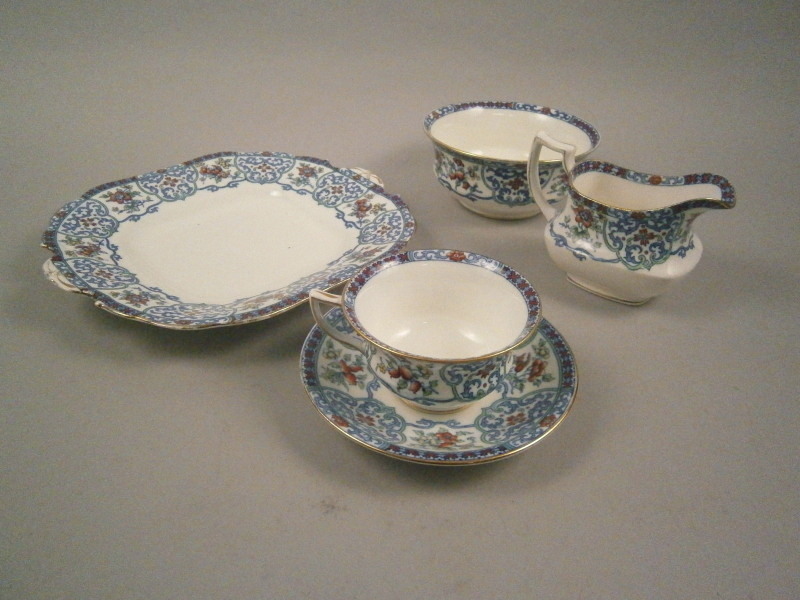 An Aynsley floral pattern part tea service, to include ten tea cups and saucers, side plates, milk