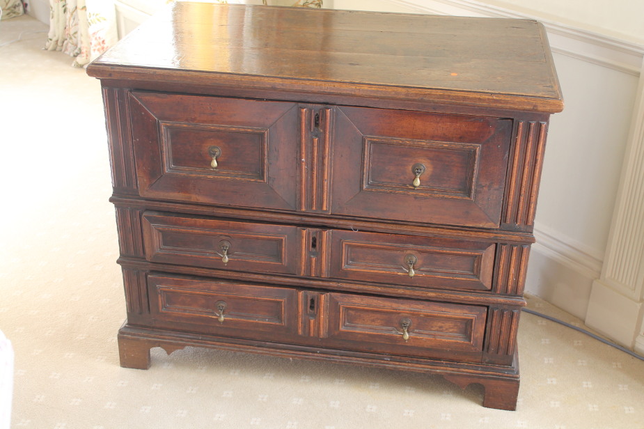 A late 17thC oak chest of three drawers, with pear drop handles and bracket feet, 104cm wide, 58cm