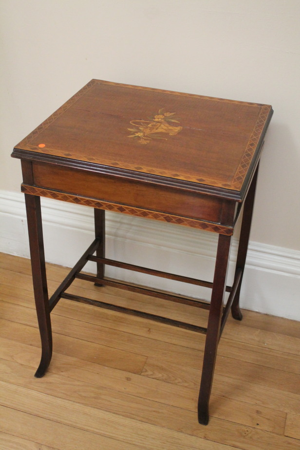 A late Victorian marquetry occasional table, with floral basket, inlaid within a banded border, 48cm