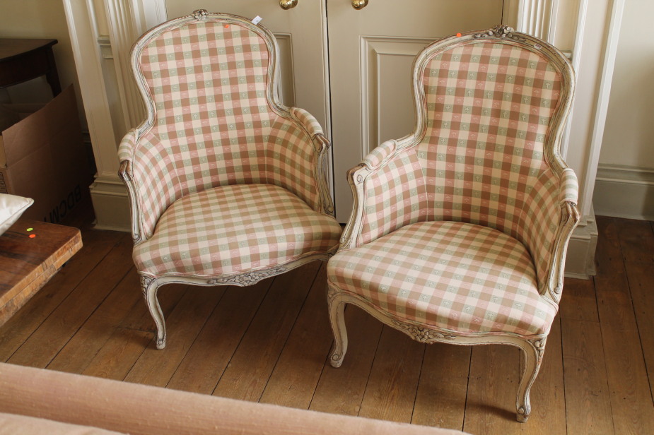 A pair of Louis XV style painted fauteils, with pink and green upholstery, 68cm wide.