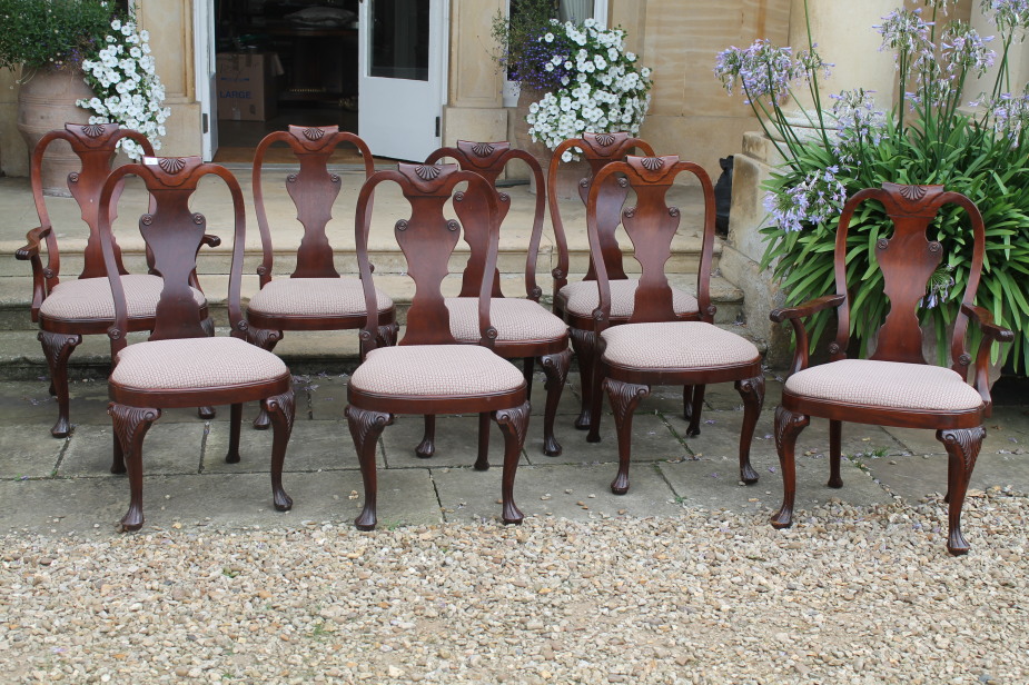 A set of eight reproduction George I dining chairs, with shell and splat backs, and including two