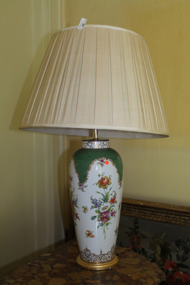 A late 19thC Continental porcelain vase converted to a table lamp, with pleated shade, 80cm high.