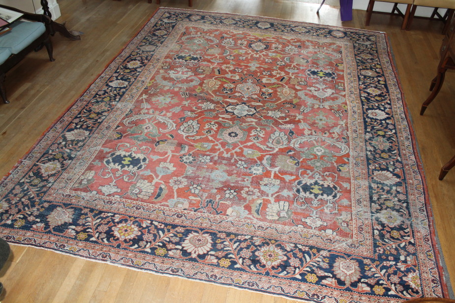 A Ziegler Mahal carpet with floral madder ground centre, within a blue banded border, 420cm x 324cm.