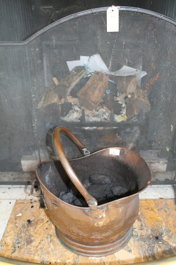 A Victorian copper coal helmet and spark guard.