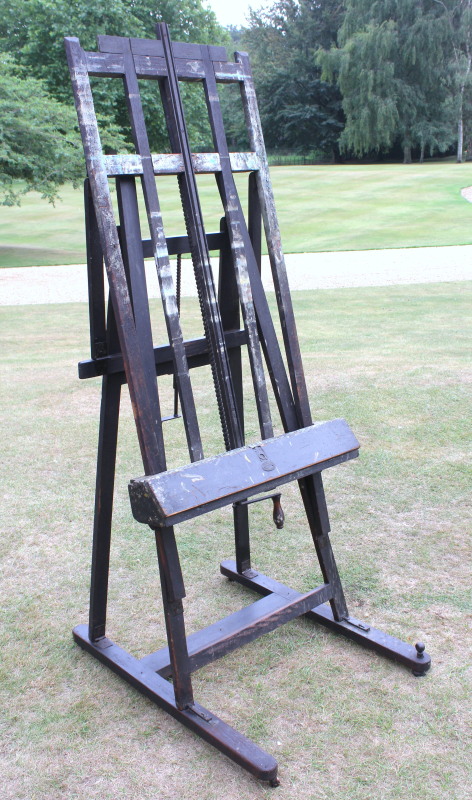 A 19thC adjustable patent stained pine artist`s easel by G. Gent, stamped number `17` and with