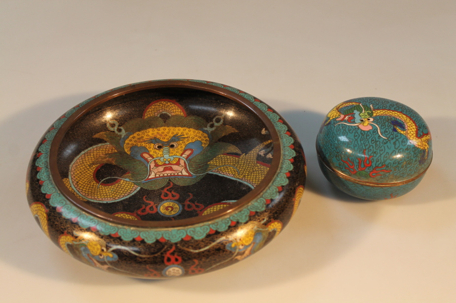 A Chinese 20thC cloisonne bowl and a small circular trinket pot, both decorated with dragon motif,