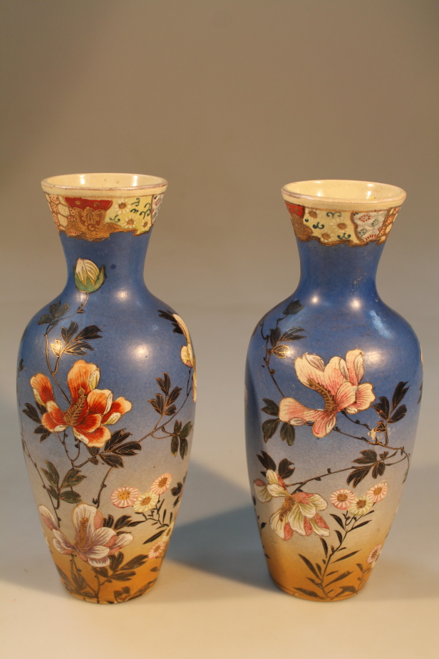 A pair of 20thC Satsuma flared bottle vases, (AF), 26cm high.
