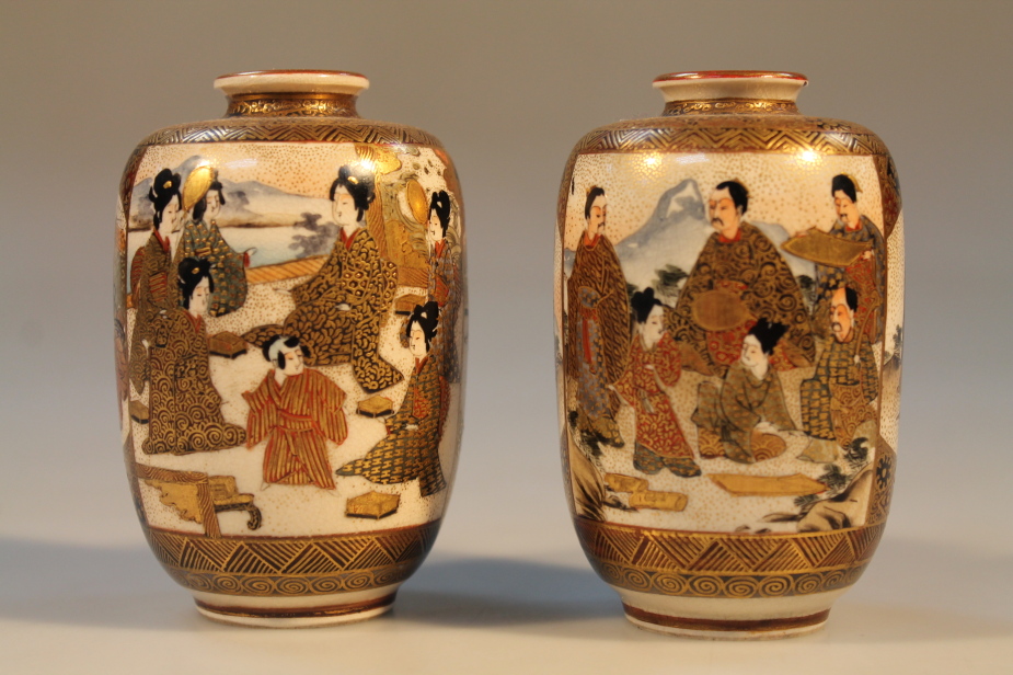 A pair of small Satsuma vases, decorated with courtesans and interior scenes, 9cm high.