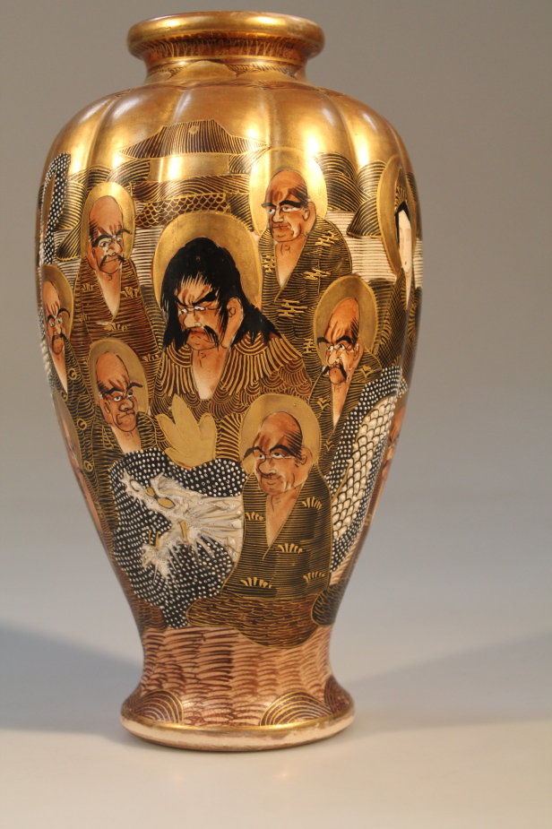 A Japanese Satsuma vase, decorated with sages, 26cm high.