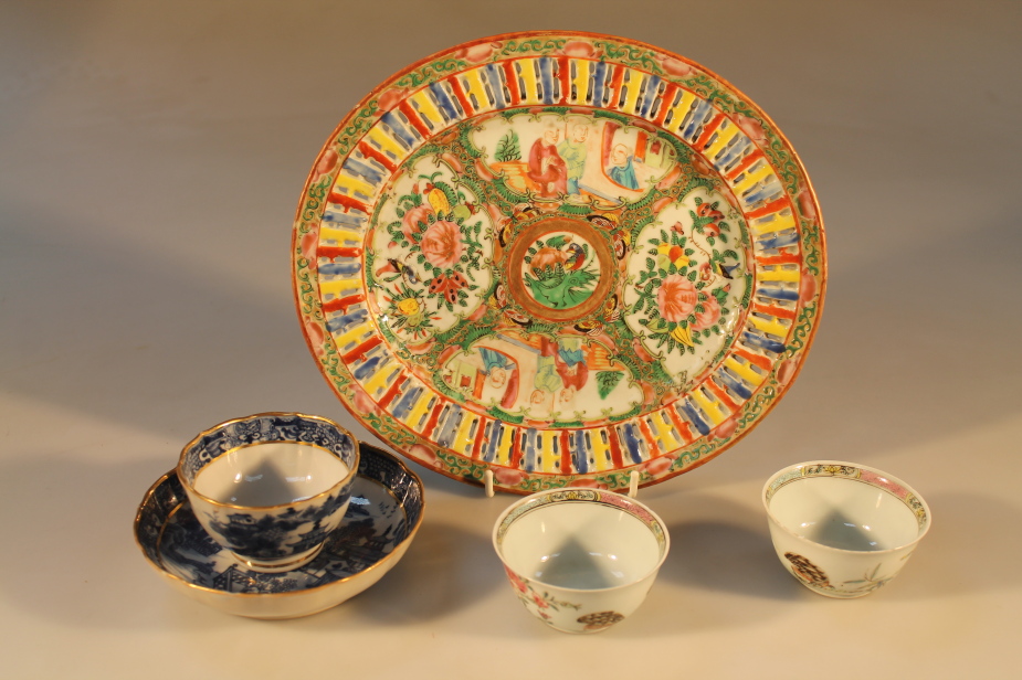 A Chinese Canton oval ribbon plate, two tea bowls, and an underglaze blue tea bowl and saucer (5)