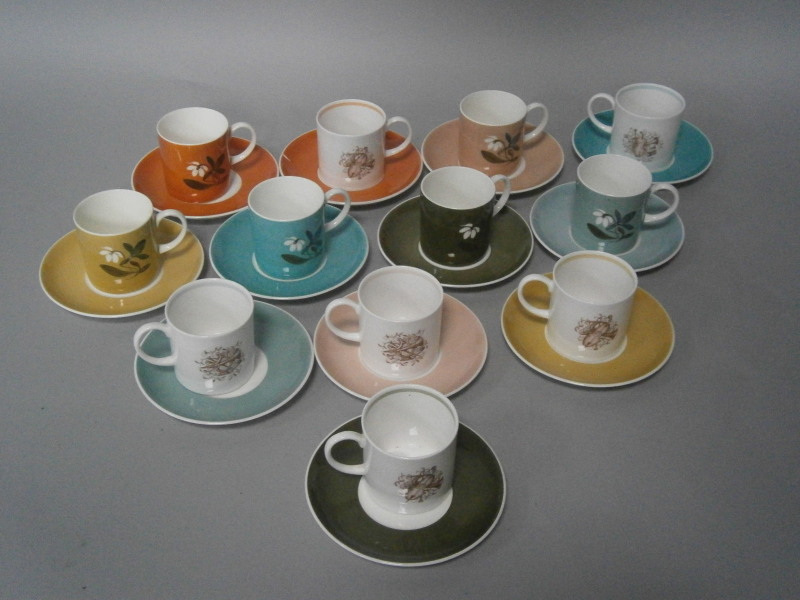 Various Susie Cooper designed coffee cans and saucers.