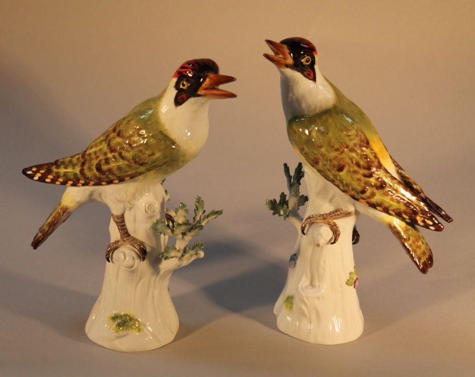 A pair of Meissen green Woodpeckers, (AF) 28cm high.