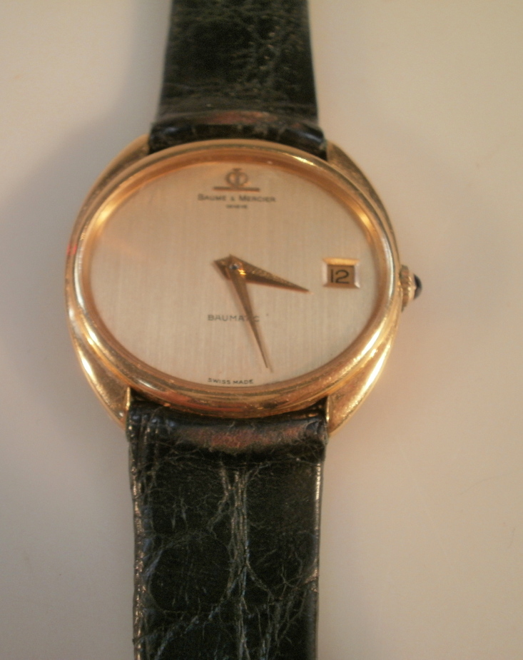 A Baume and Mercier Baumatic gentleman`s dress wristwatch, with leather strap, 18ct gold case,