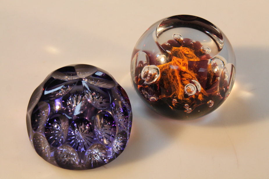 A Caithness diadem abstract paperweight, and another (2)