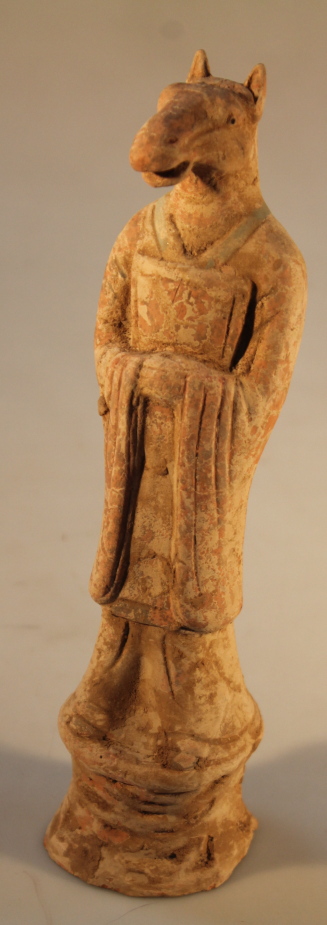 A Tang Dynasty style terracotta figure with horse`s head, 28cm high.