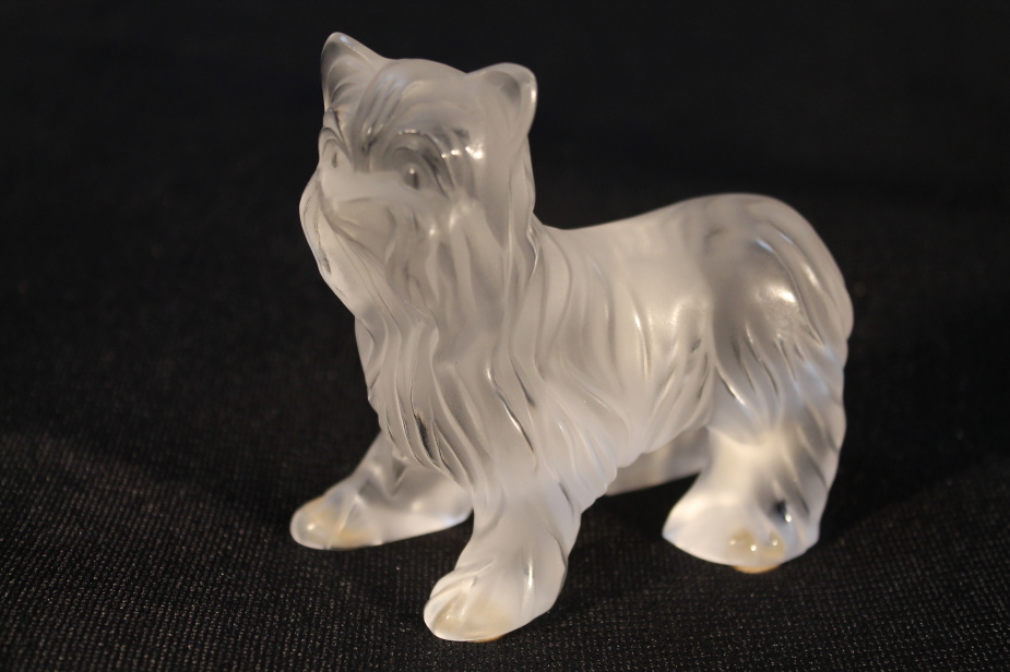 A Lalique figure, of a small dog, etched mark to base, 9cm high.