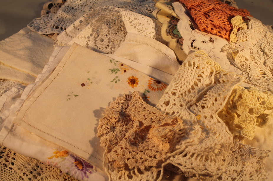 A quantity of macrame and crochet tray cloths, etc.