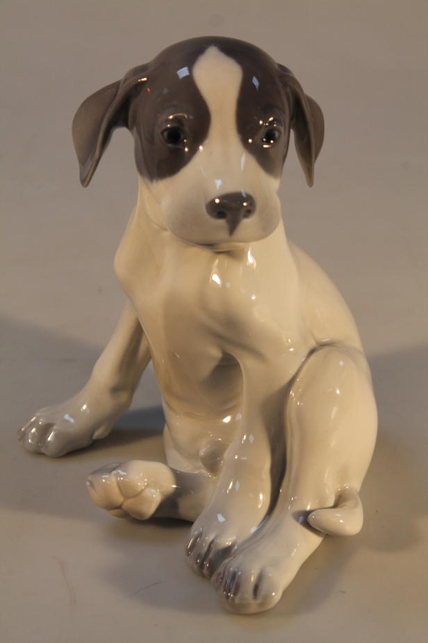 A Royal Copenhagen figure of a puppy, 20cm high.