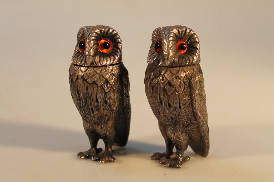 A pair of Elizabeth II silver novelty salt and pepper pots, in the form of owls, by Richard