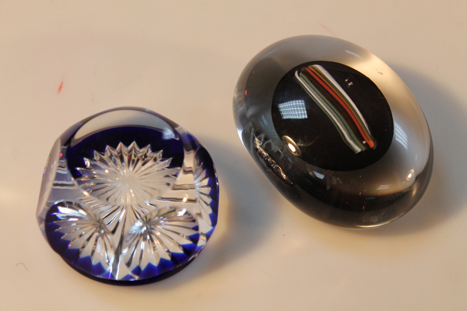 A glass paperweight, engraved B. Valliee, and another abstract paperweight. (2)