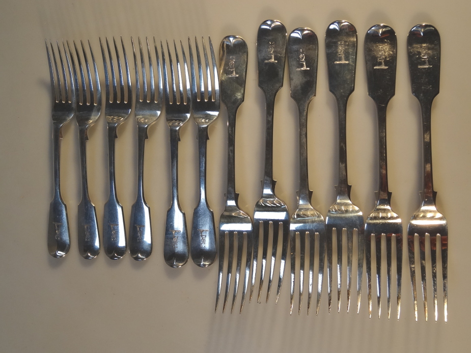 A set of Victorian silver fiddle pattern dinner forks and matching dessert forks, all engraved
