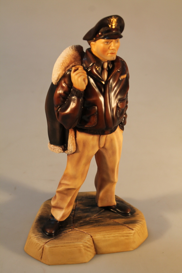 An Ashmor porcelain figure of a United States Air Force pilot, transfer mark to base, 27cm high.