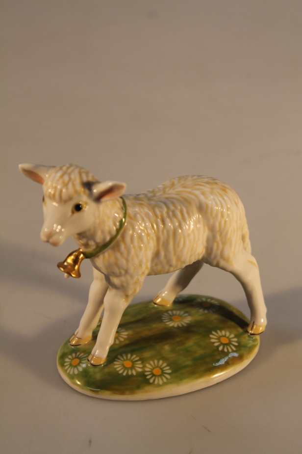 A Nymphenburg porcelain figure of a lamb, transfer mark to base, 10cm high.