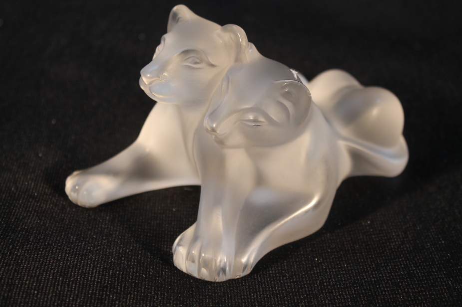 A Lalique glass figure group of two lion cubs, dated 17.11.1990, etched mark to base, 12cm long, 7cm