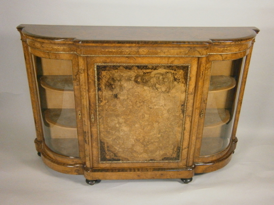 A Victorian burr walnut and marquetry credenza, with gilt metal mounts, the top with a moulded