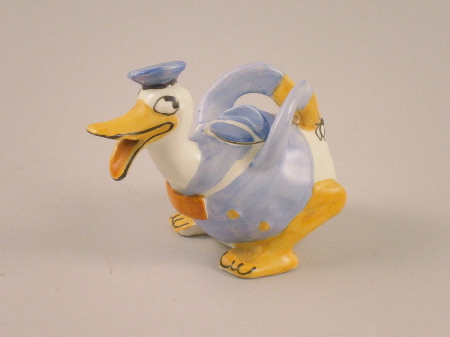 A Wade Heath ceramic Donald Duck teapot, picked out in blue, red and orange, printed mark to base,
