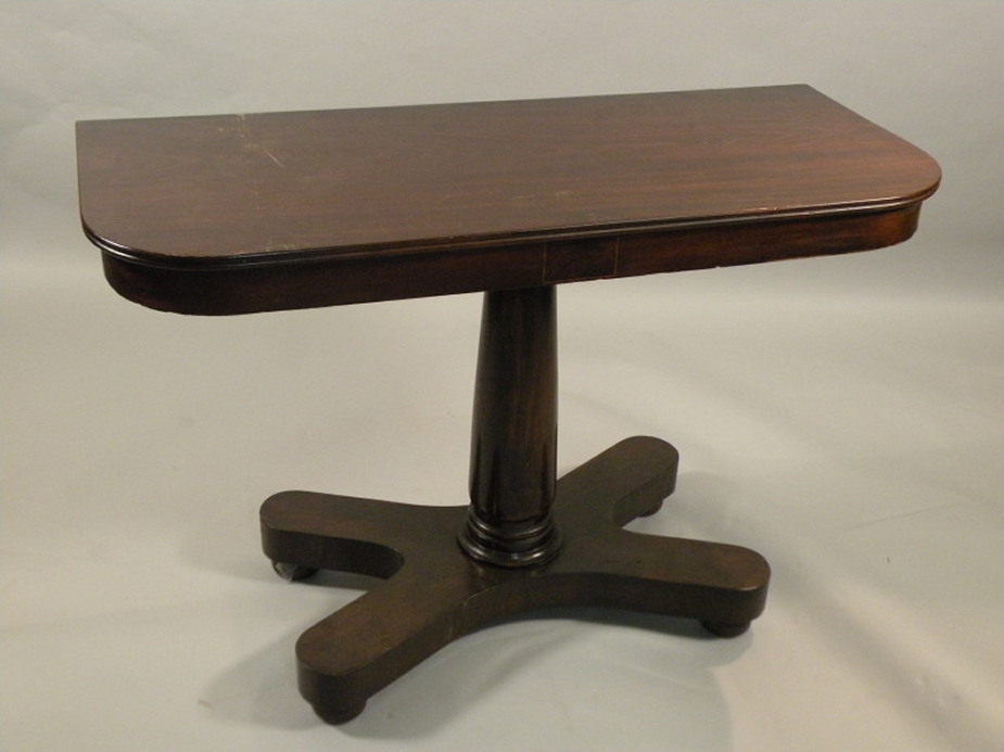 A 19thC mahogany side table, the rectangular top with rounded corners, on a turned support with X