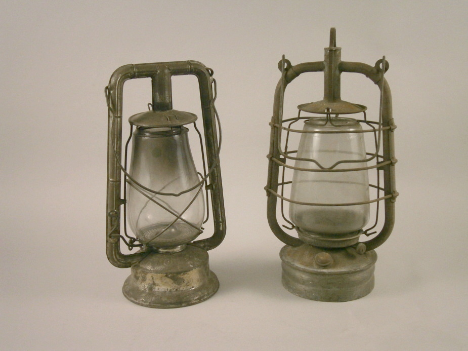 Two early 20thC British made painted in paraffin lamps.