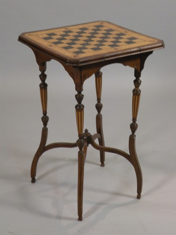 A late 19thC/ early 20thC mahogany and specimen timber occasional table, the square top inlaid