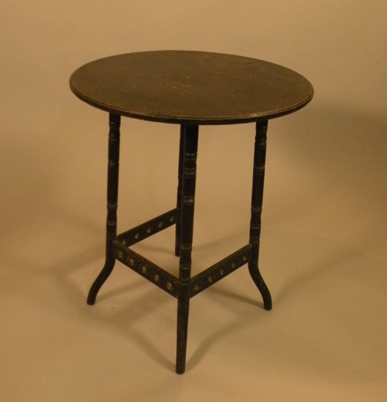 A Victorian ebonised aesthetic movement table, with turned legs and pierced stretchers, the top 55cm
