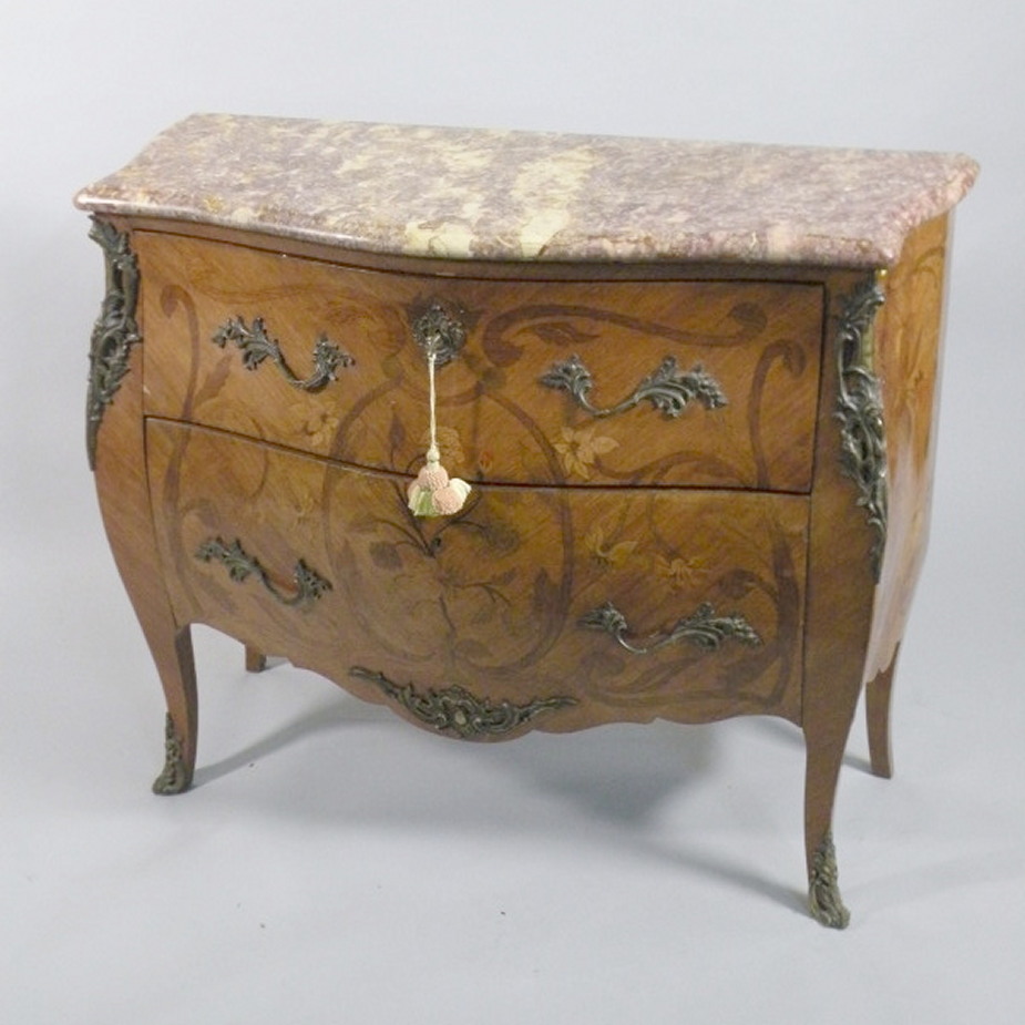 A Continental serpentine commode, with a purple variegated marble top above two marquetry drawers