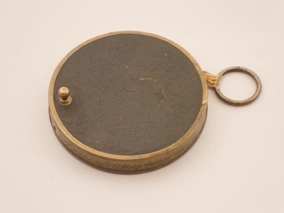 A 19thC brass tape measure, bearing the inscription `Charles White was transported for seven years