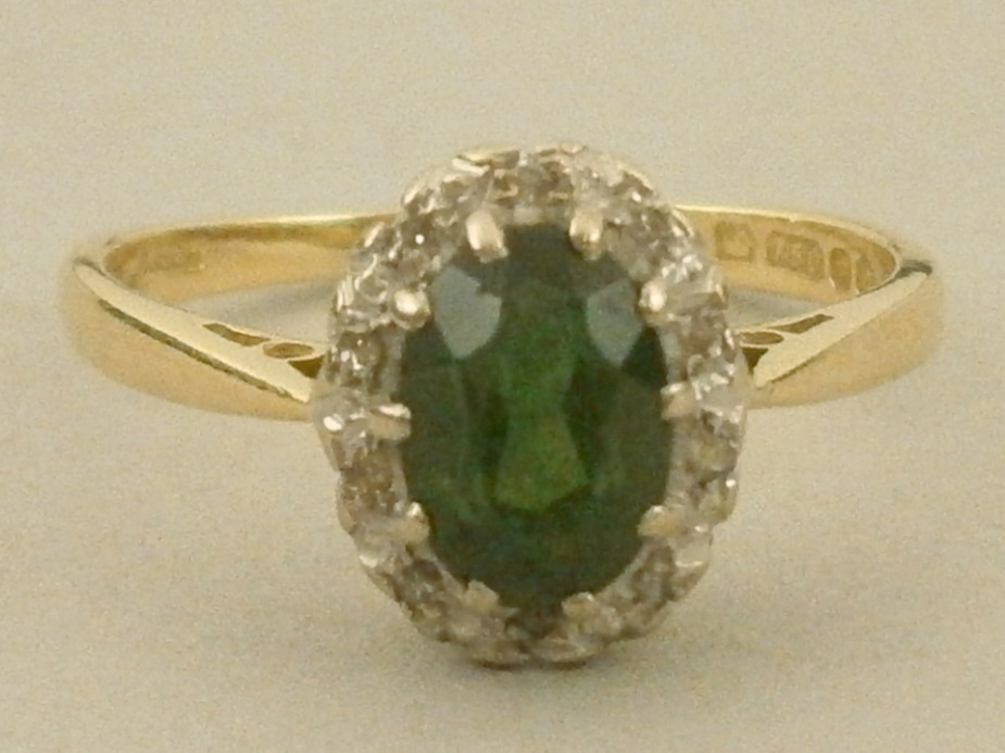 A tourmaline and tiny diamond set cluster dress ring, 18ct gold setting, 2.5g.