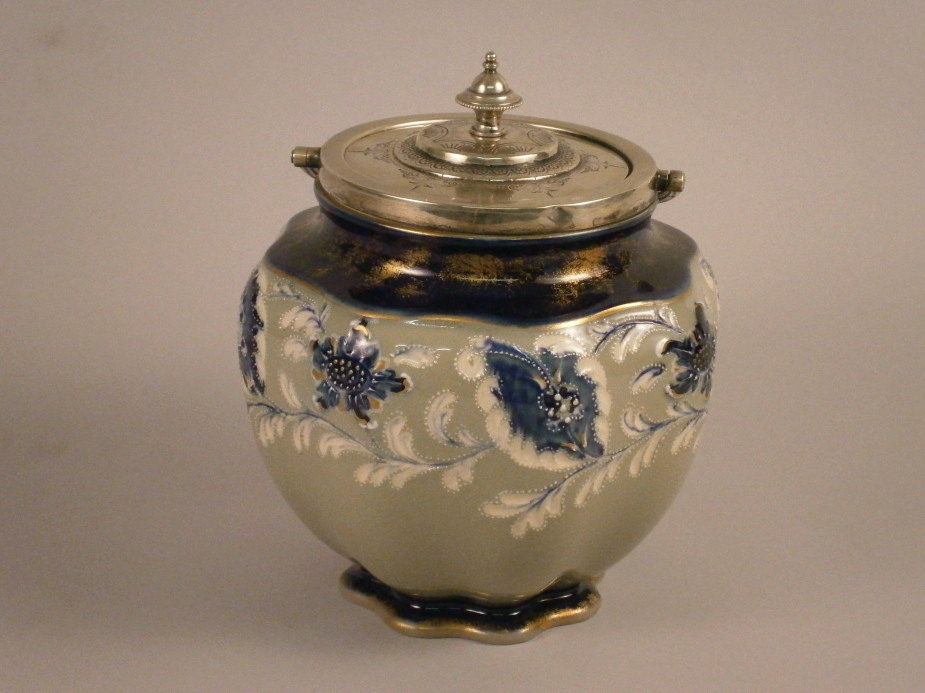 A MacIntyre ceramic vase, with incised and beaded decoration, and silver plated mounts, 19cm high.