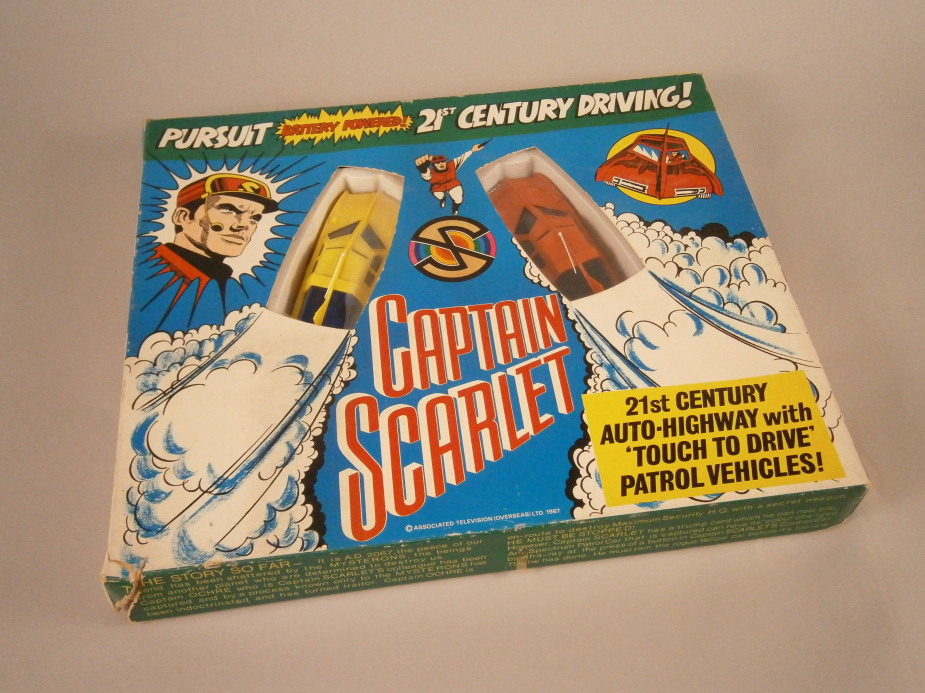 A Tri-ang 1960`s Captain Scarlett battery powered pursuit 21st driving game, in original box, 44cm