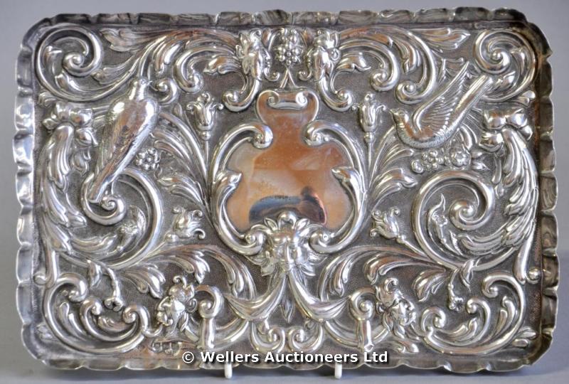 "A silver rectangular tray, decorated with masks, birds and flowers, London 1897, makers mark of