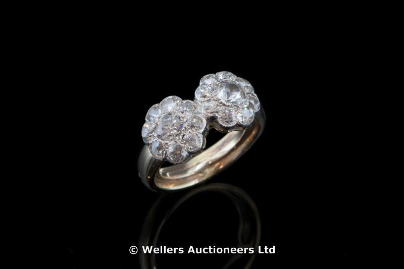 "Diamond cluster ring, set with two daisy clusters of old cut diamonds, mounted in white metal on